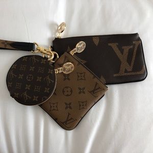 Louis Vuitton trio wristlet